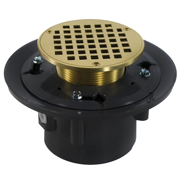 Jones Stephens 4in. Heavy Duty PVC Drain Base with 3-1/2in. Metal Spud and 6in. Polished Brass Strainer D49261 - main